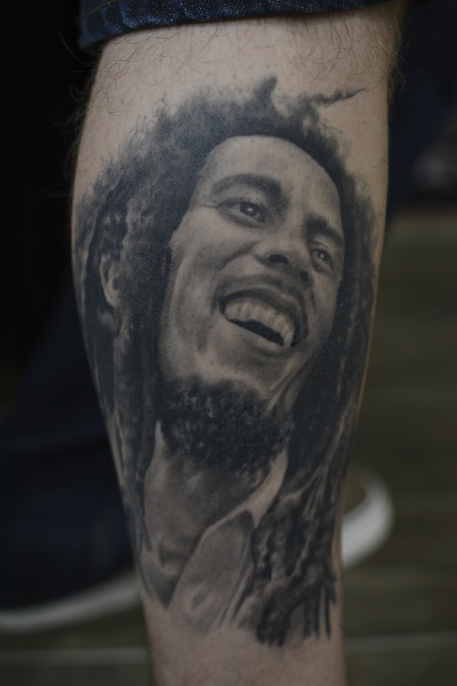Right Leg Grey Ink Bob Marley Tattoo