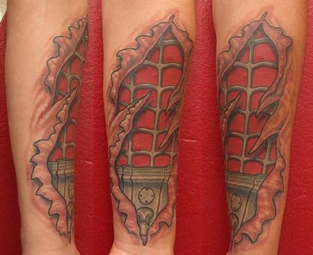 Ripped Skin Spiderman Tattoo on Left Forearm