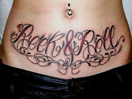 Rock & Roll Lettering Tattoo On Girl Stomach