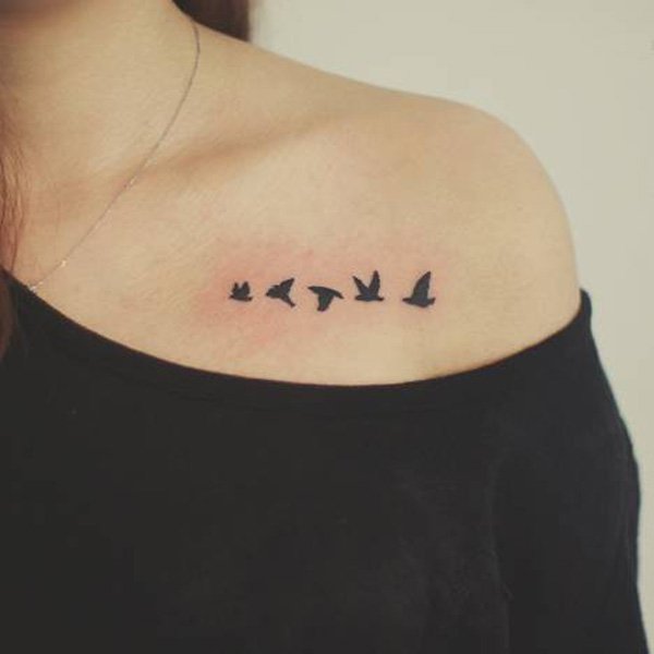 Silhouette Five Flying Birds Tattoo On Girl Left Collar Bone