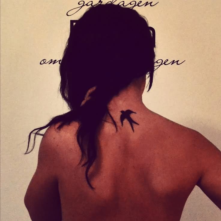 Silhouette Flying Bird Tattoo On Back Neck
