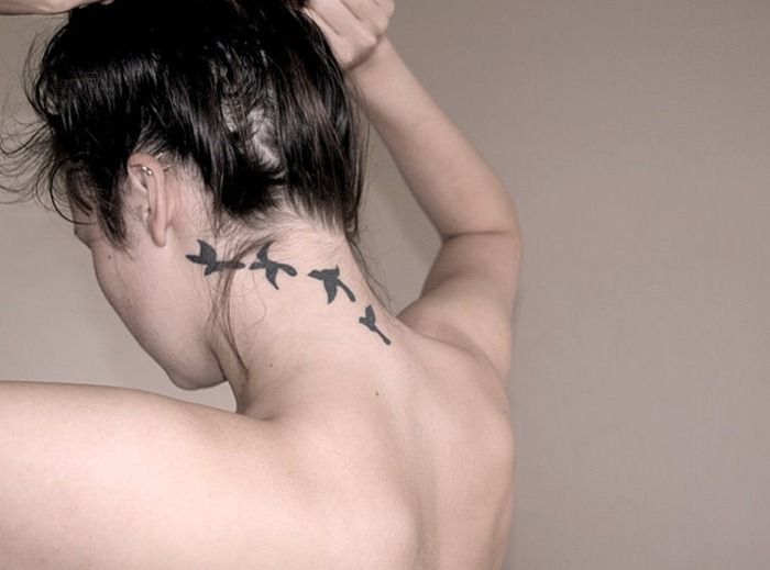 Silhouette Flying Bird Tattoo On Girl Back Neck