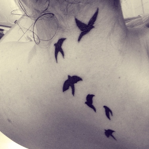 Silhouette Flying Birds Tattoo On Girl Back Neck