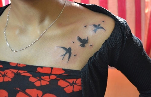 Silhouette Flying Birds Tattoo On Left Collar Bone