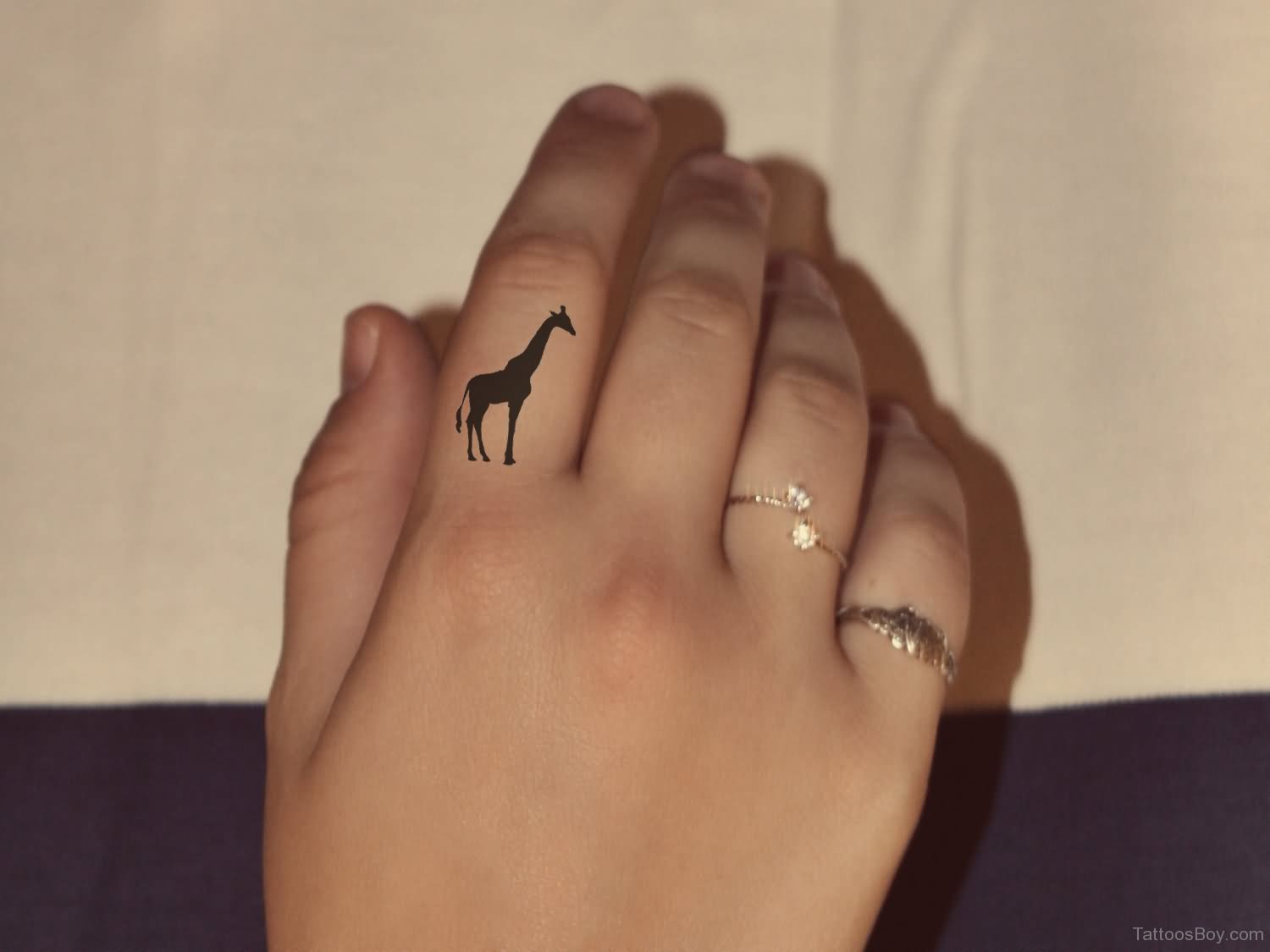 Silhouette Giraffe Tattoo On Girl Finger