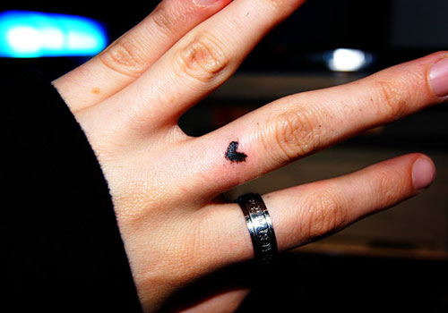 Silhouette Little Heart Tattoo On Finger