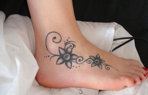 Simple Black Flowers Tattoo On Girl Right Foot