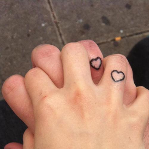 Simple Black Outline Heart Tattoo On Couple Finger