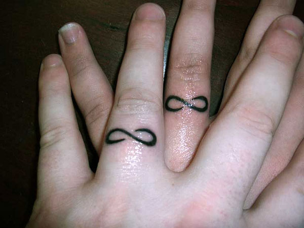 Simple Infinity Ring Tattoo On Couple Finger