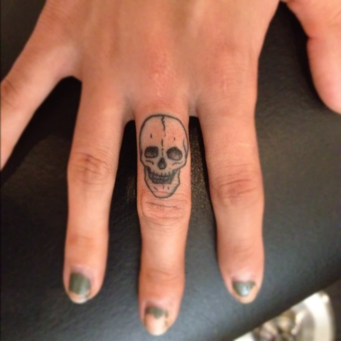Skull Tattoo On Girl Finger