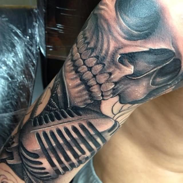 Skull With Mic Tattoo On Sleeve