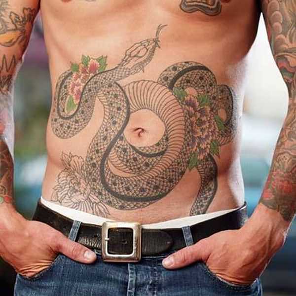 Snake With Flowers Tattoo On Man Stomach