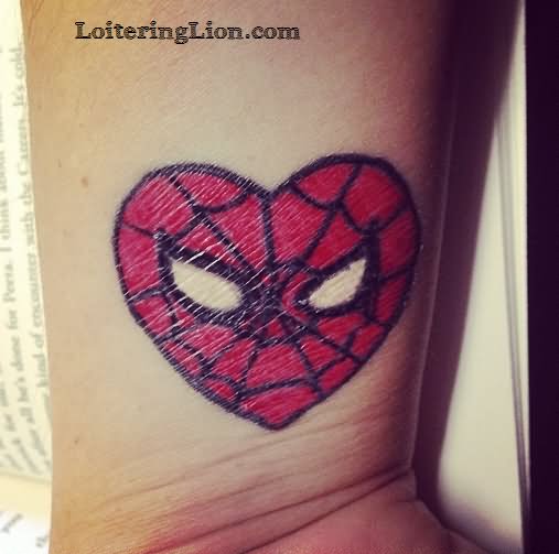 Spiderman Face In Heart Tattoo On Wrist