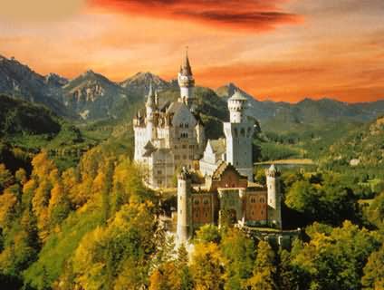 Sunset View Image Of The Neuschwanstein Castle In Bavaria, Germany
