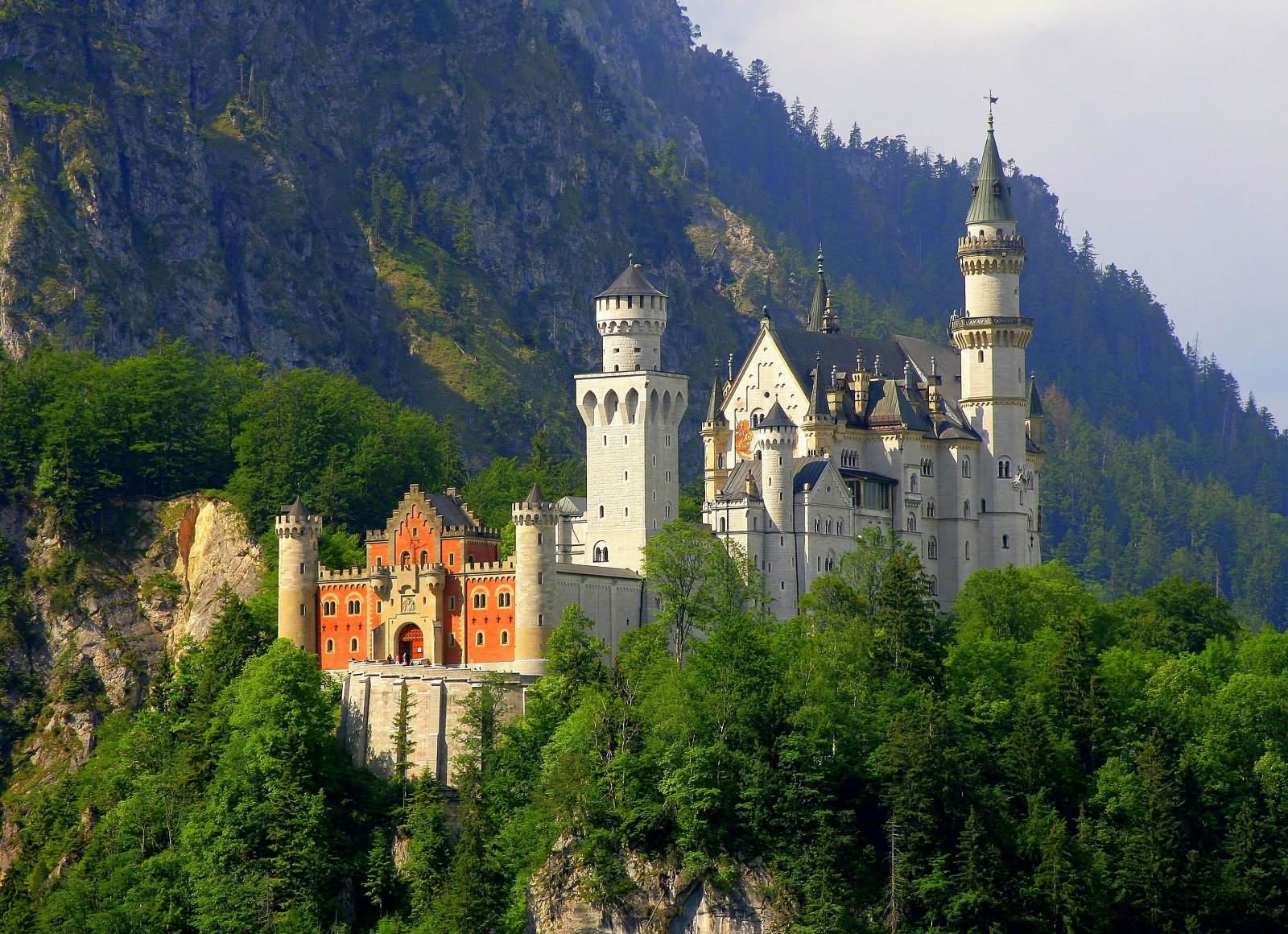 The Neuschwanstein Castle Covered With Green Mountains