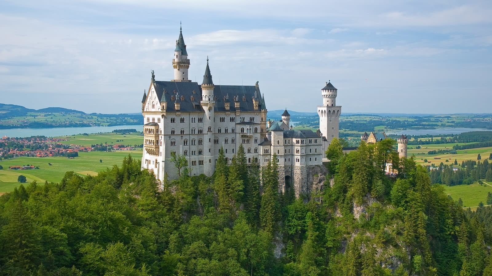The Neuschwanstein Castle Surrounded With Green Trees