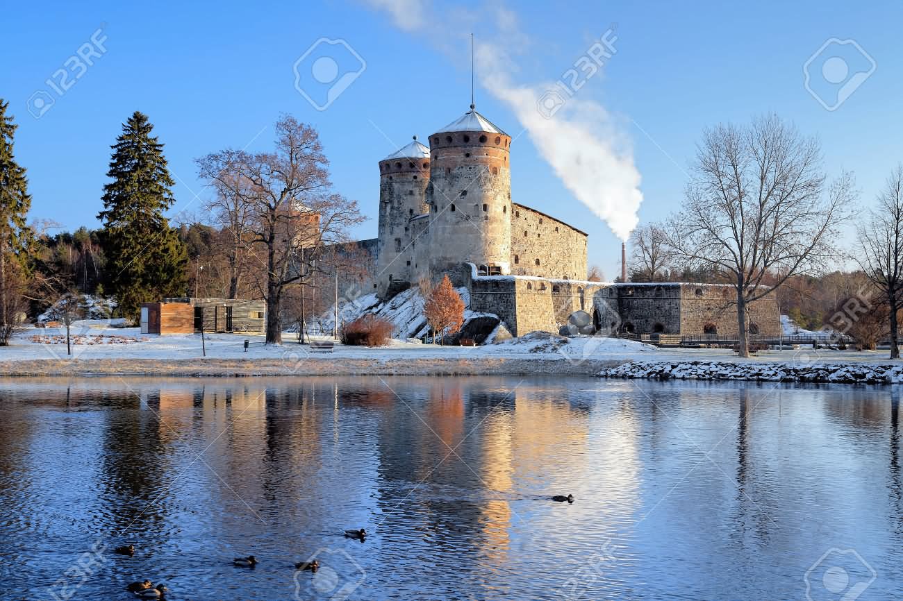 The Olavinlinna Castle During Winter Season View Across The Lake