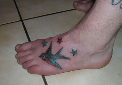 Traditional Bird With Stars Tattoo On Left Foot