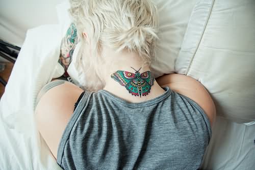 Traditional Butterfly Tattoo On Girl Back Neck