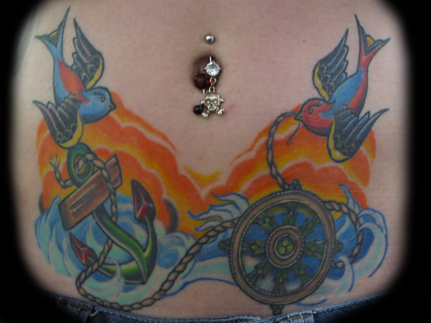 Traditional Flying Birds With Anchor And Ship Wheel Tattoo On Girl Stomach