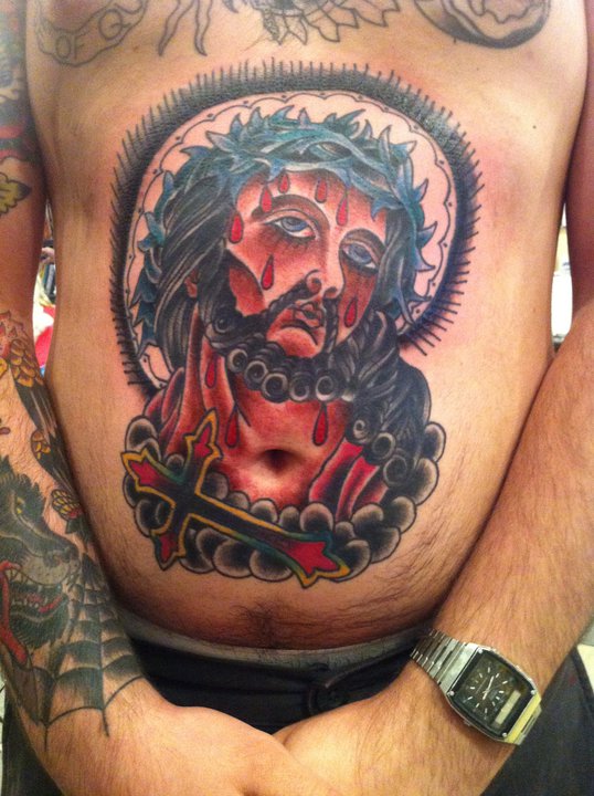 Traditional Jesus Face With Cross Tattoo On Man Stomach