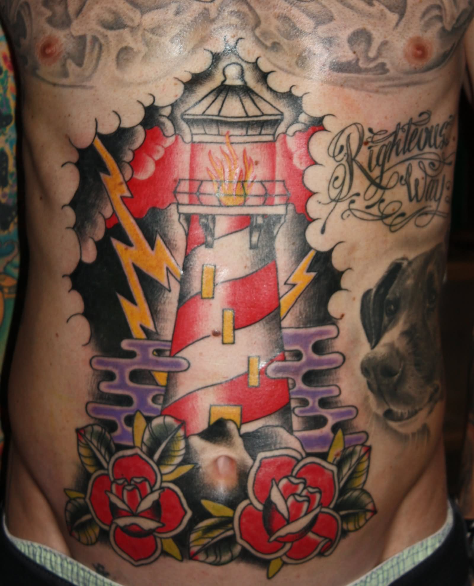 Traditional Lighthouse With Roses Tattoo On Man Stomach