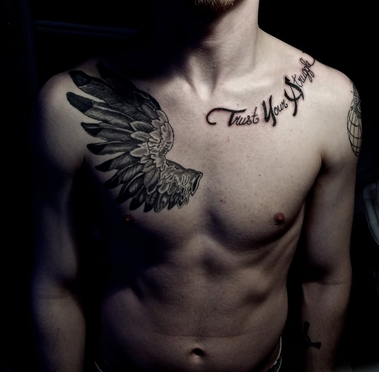 Trust Your Struggle Lettering And Wing Tattoo On Man Collar Bone