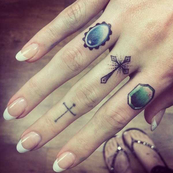 Two Cross Tattoo On Girl Finger