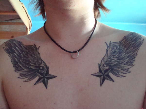 Two Nautical Star With Wing Tattoo On Man Chest