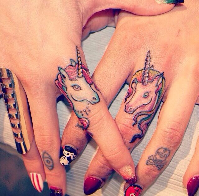 Two Unicorn Head Tattoo On Girl Fingers