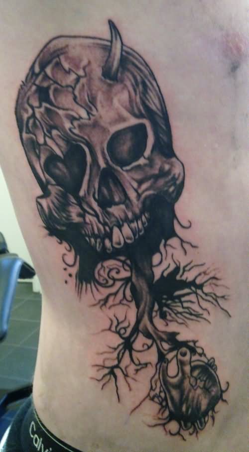Unique Black Ink Gothic Skull Tattoo Design For Side Rib By Gord Kennedy