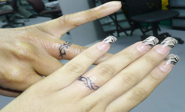 Unique Infinity Ring Tattoo On Couple Finger