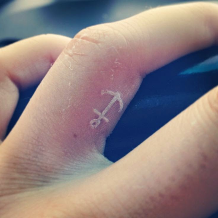 White Ink Anchor Tattoo On Finger