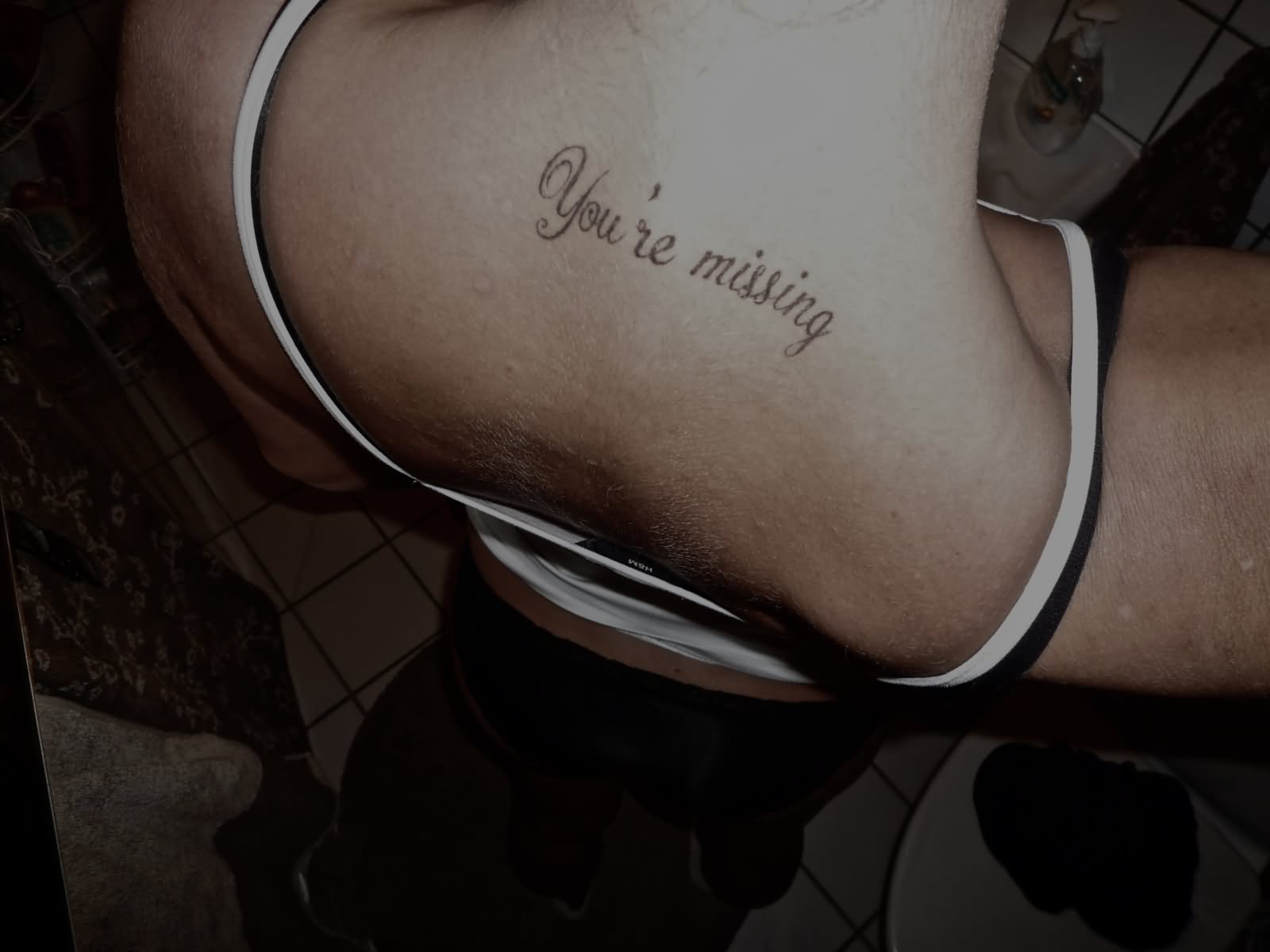 You're Missing Words Tattoo On Back Neck