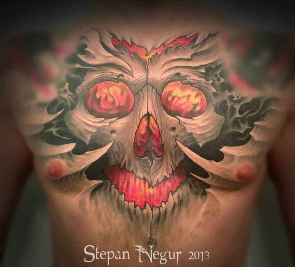 3D Ripped Skin Horror Skull Tattoo On Man Chest