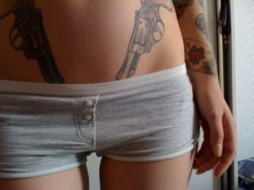 Amazing Grey Ink Revolver Tattoos On Hip