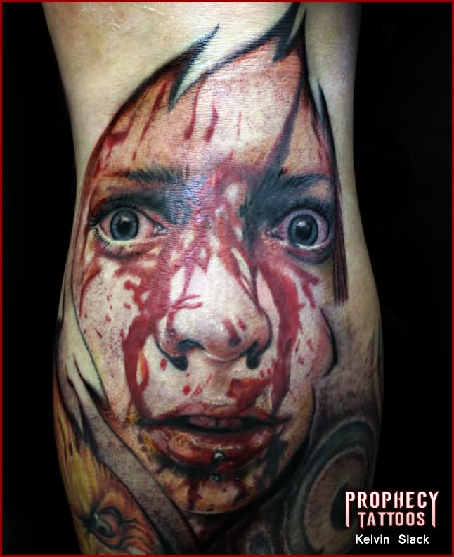 Amazing Ripped Skin Horror Face Tattoo Design For Leg