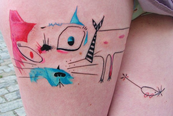 Attractive Abstract Cat Face Tattoo Design For Thigh