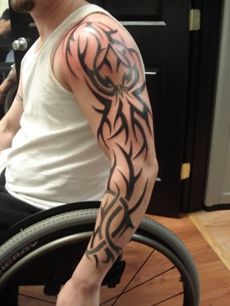 Attractive Black Tribal Design Tattoo On Man Left Full Sleeve