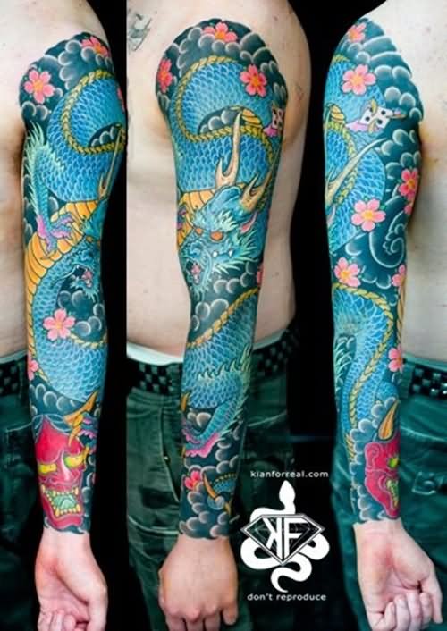 Attractive Colorful Dragon With Flowers Tattoo On Left Full Sleeve