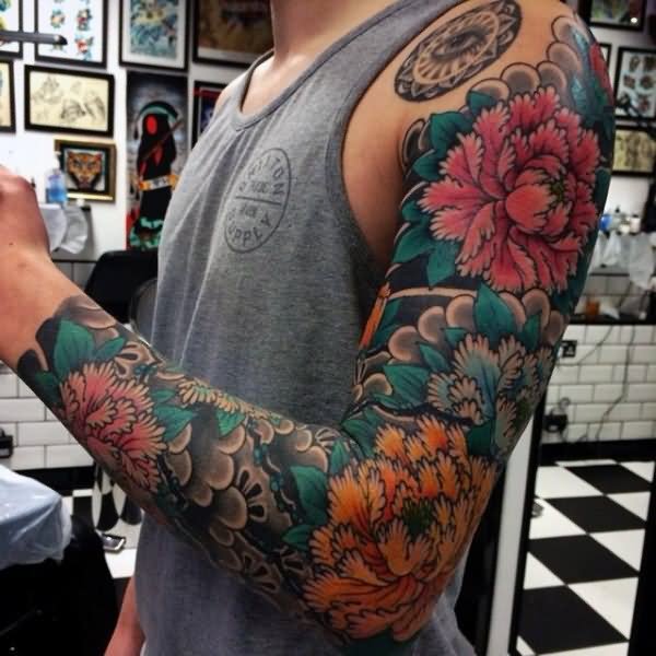 Attractive Japanese Flowers Tattoo On Man Left Full Sleeve
