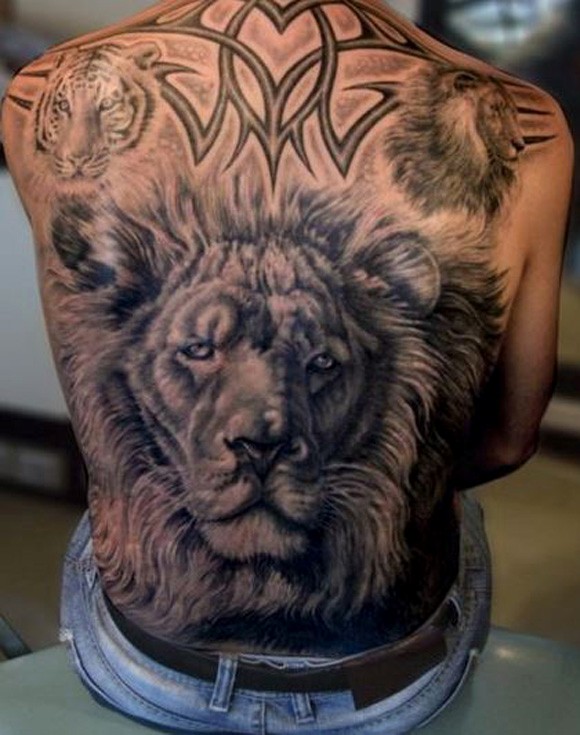 Awesome Lion Head With Tribal Design Tattoo On Full Back