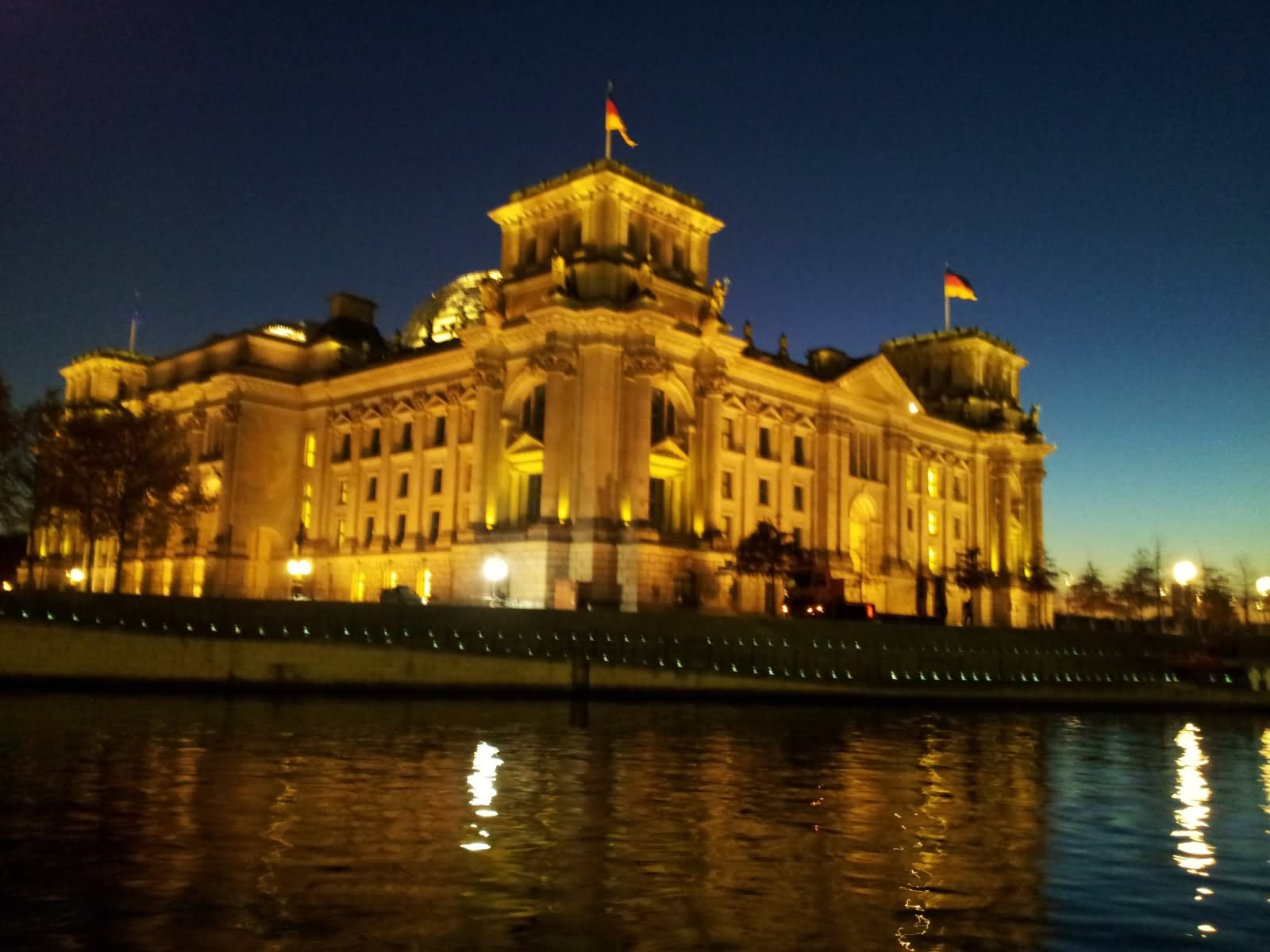 Back View Of The Reichstag Building Illuminated At Night