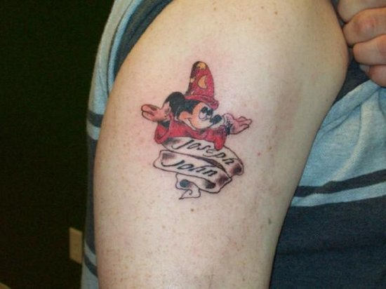 Banner And Mickey Mouse Tattoo On Right Bicep