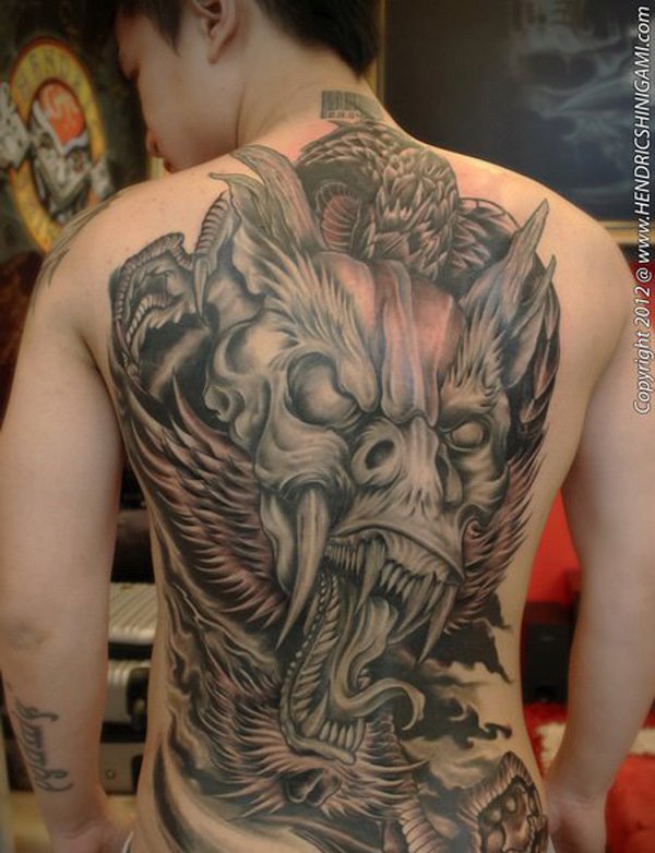 Black And Grey Japanese Dragon Face Tattoo On Man Full Back
