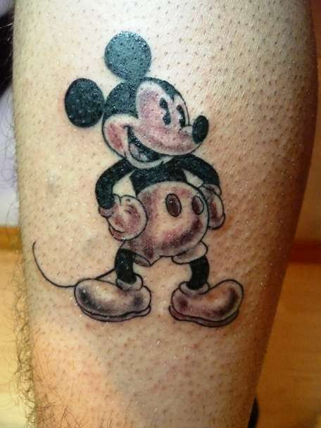 Black And Grey Mickey Mouse Tattoo On Leg