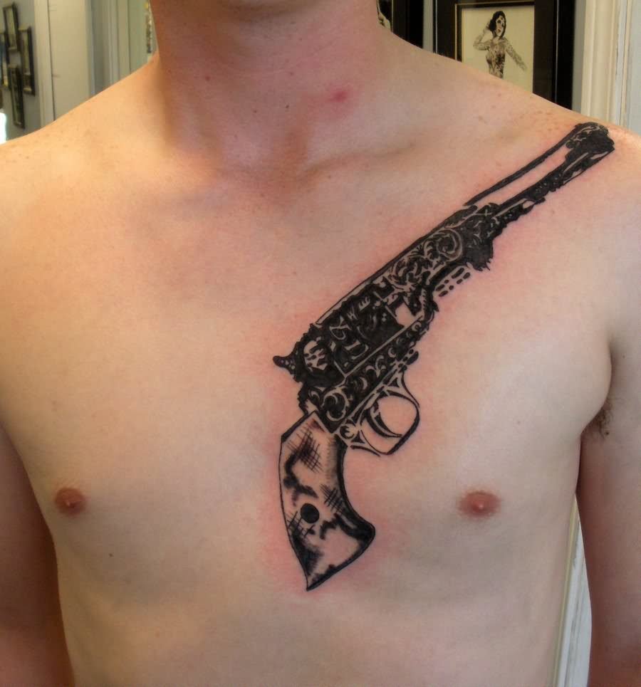 Black And Grey Revolver Tattoo On Man Chest