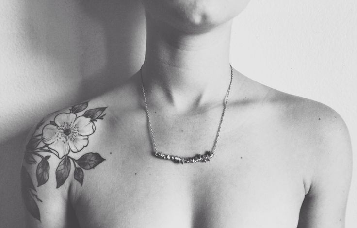 Black And White Poppy Flower Tattoo On Man Right Shoulder