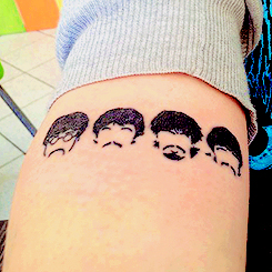 Black Beatles Faces Tattoo Design For Leg