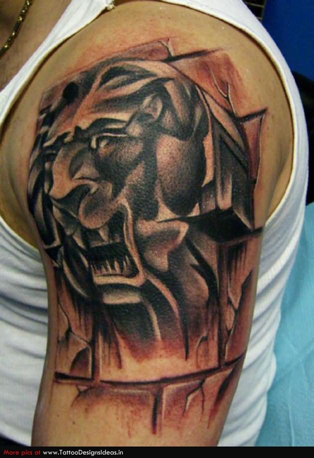 Black Ink Abstract Lion Head Tattoo On Man Left Shoulder